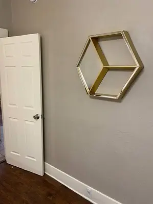 a mirror hanging on a wall next to a door at 2 King Beds! Fantastic Stylish Bungalow home! in Fresno