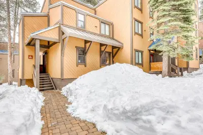 a pile of snow in front of a house at Evergreen Escape in Truckee