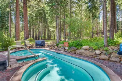a swimming pool in a yard with trees at Evergreen Escape in Truckee