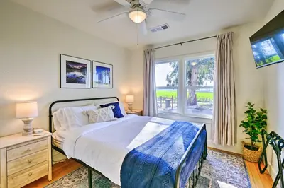 a bedroom with a bed and a window at Peaceful Ranch Home with Sierra Nevada Views in Woodlake