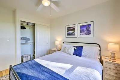 a bedroom with a bed with blue and white sheets at Peaceful Ranch Home with Sierra Nevada Views in Woodlake