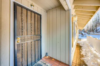 a front door of a house with snow on the ground at Lakeview Serenity in Incline Village