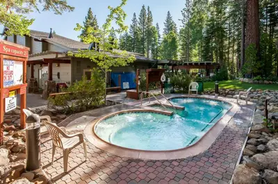 a swimming pool in the backyard of a house at Silver Strike Serenity in Truckee