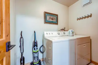 a white washer and dryer in a laundry room at The Pines at Rocky Point in Truckee