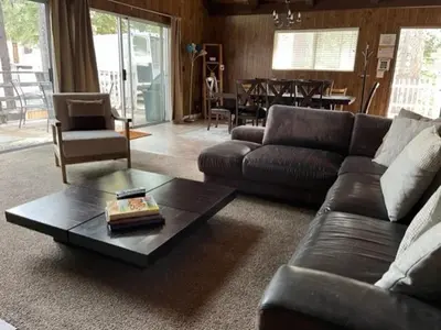 a living room with a couch and a coffee table at Close To Heaven With Hot Tub, Wet Bar & Game Room in South Lake Tahoe