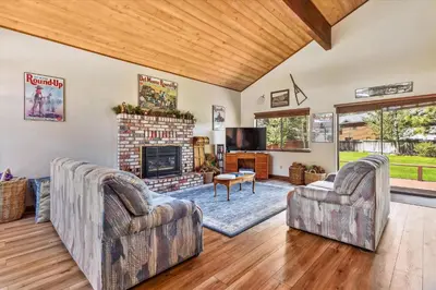a living room with two chairs and a fireplace at Minutes From Heavenly Valley & Lake Tahoe Beaches in South Lake Tahoe