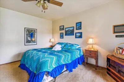 a bedroom with a bed and a ceiling fan at Minutes From Heavenly Valley & Lake Tahoe Beaches in South Lake Tahoe