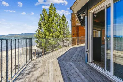 a large deck with a view of the beach at Private Beach, Close To Everything in South Lake Tahoe