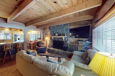 a living room with a couch and a fireplace at Walkup Pines in South Lake Tahoe