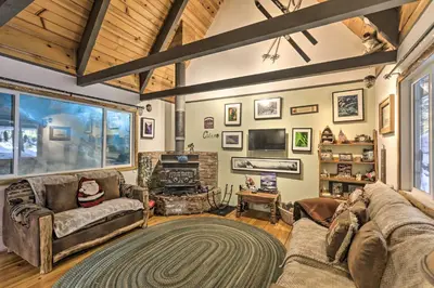 a living room with a couch and a fireplace at 8 Mi to Heavenly Mtn Resort! Hot Tub Hideaway in South Lake Tahoe