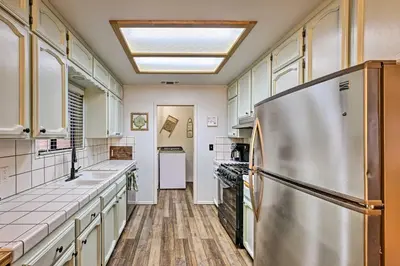 a large kitchen with a stainless steel refrigerator at North Fork Vacation Rental 28 Mi to Yosemite in North Fork