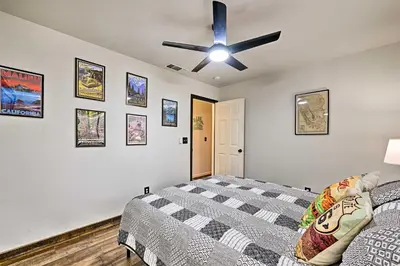 a bedroom with a bed and a ceiling fan at North Fork Vacation Rental 28 Mi to Yosemite in North Fork
