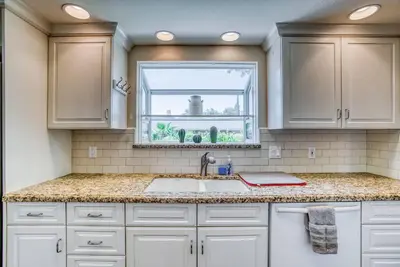 a kitchen with a sink and a window at X-Large Spacious Deluxe House Fastest Wi-Fi in Fresno