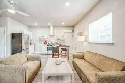 a living room with two couches and a table at Stylish Studio 89 Brand New from the floor up in Fresno