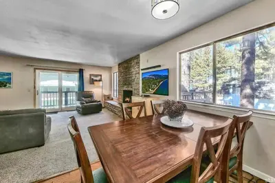 a living room with a wooden table and chairs at Lake Views in 3bdr Family Home w/ Hottub in South Lake Tahoe
