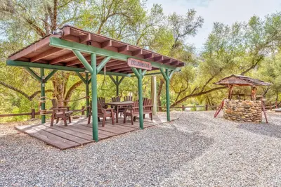 a picnic shelter with a table and a playground at Goldside Mansion w/sleeping for 20 and tons of fun in Oakhurst