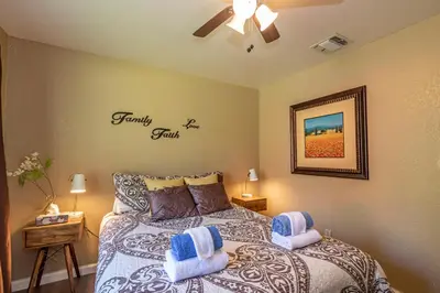 a bedroom with a bed with two pillows on it at Starry Pines- Pet friendly/spa/affordable in Oakhurst