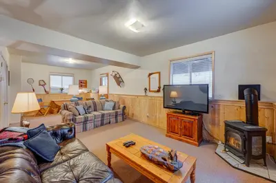 a living room with a couch and a tv at Tahoe Donner Greenbelt Retreat in Truckee