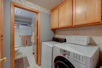 a small laundry room with a washer and dryer at Tahoe Donner Greenbelt Retreat in Truckee