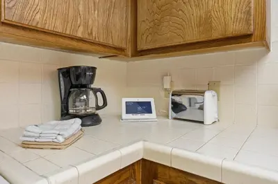 a kitchen counter with a blender and a toaster at Heavenly Chairview Condo home in Stateline
