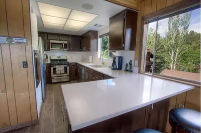 a kitchen with a large white counter top and a window at The Heights home in Zephyr Cove