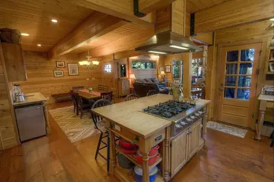 a kitchen with a stove and a counter in a cabin at Smokey Joes cabin in Zephyr Cove