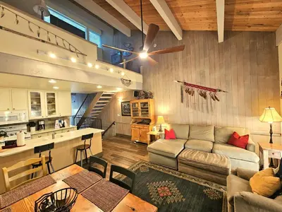 a large living room with a couch and a kitchen at Cheyenne's Place home in Kings Beach