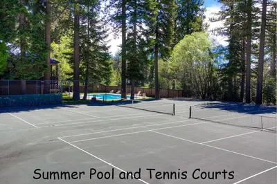a tennis court with two tennis nets on it at Alpine Getaway home in Tahoe City