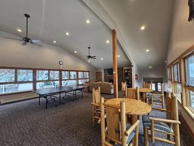 a dining room with a table and chairs at Raccoon Roost condo in Incline Village