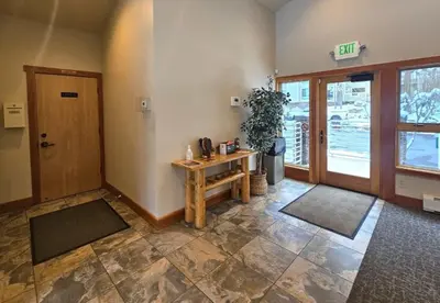 a room with a door and a table and aoyer with a door at Cartwright Corner Condo townhouse in Incline Village