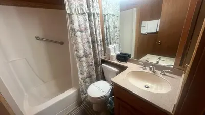 a bathroom with a sink and a toilet and a shower at Chimney Rock Condo condo in Stateline