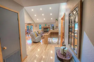 a large living room with a kitchen and a living room at Gale Force Wind home in Incline Village