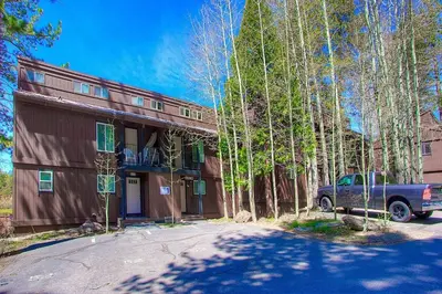 a blue truck parked in front of a house at Park View Paradise condo in Tahoe City