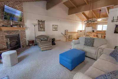 a living room filled with furniture and a fireplace at Whispering Wood home in Incline Village