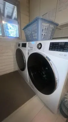 a washing machine with a basket on top of it at Cheyenne Chalet home in Round Hill