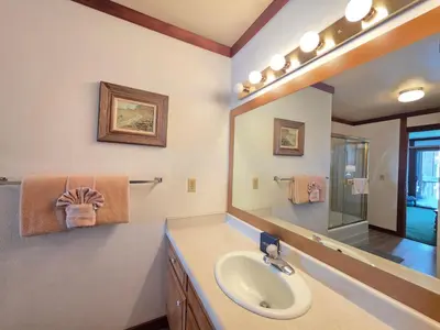 a bathroom with a sink and a mirror at Brockway Beachside Bungalo home in Kings Beach