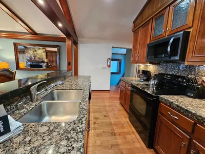 a kitchen with a sink and a stove at Brockway Beachside Bungalo home in Kings Beach