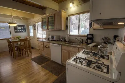 a kitchen with a stove and a counter top at Cozy Mountain Hideaway home in Incline Village