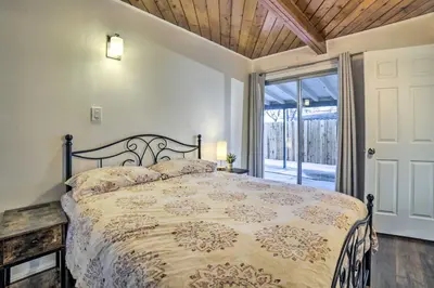 a bedroom with a large bed and a window at Gateway to Mt Rose Ski! Reno Home with Fireplace in Reno