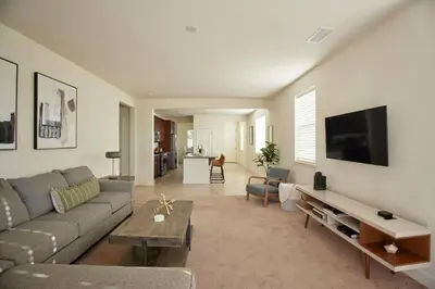 a living room with a couch and a table at NEW Upscale House, Tahoe 30-min w/ Cal King in Steamboat