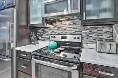 a kitchen with a stove with a teapot on it at Mammoth Lakes Condo with Pool and Spa Access! in Mammoth Lakes