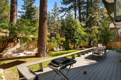 a bbq grill on a deck in a yard at The Home at the End of the Rainbow in South Lake Tahoe
