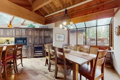 a kitchen with a dining room table and chairs at North Star Mountain Retreat in Truckee