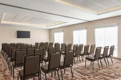 a conference room with chairs and a flat screen tv at Hampton Inn Stockton, Ca in Stockton