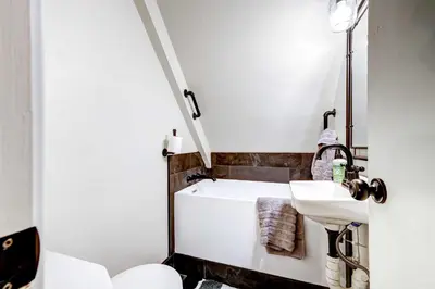 a bathroom with a sink and a toilet at Hike, Fish and Explore California Cabin with Deck! in Long Barn