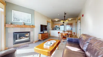 a living room with a couch and a fireplace at Sunstone #231 condo in Mammoth Lakes