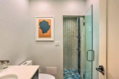 a bathroom with a shower and a toilet and a sink at Peaceful Oak Haven Cabin near Yosemite in Mariposa