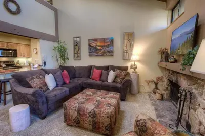 a living room with a couch and a fireplace at Our Happy Place home in South Lake Tahoe