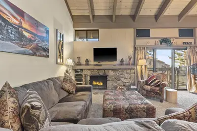 a living room with a couch and a fireplace at Our Happy Place home in South Lake Tahoe