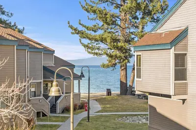 a view of the water between two houses at Our Happy Place home in South Lake Tahoe